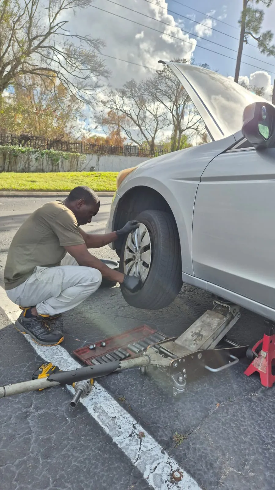 A skilled mechanic changing the tires of a car